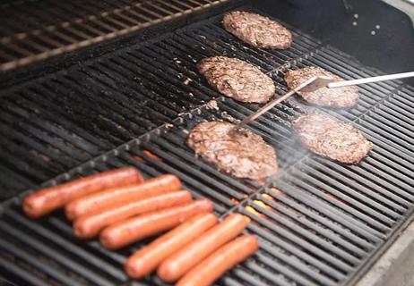 Grilling burgers on the grill