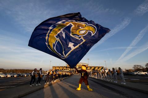 Flash, Kent State University’s mascot, waves a flag in front of Dix Stadium before a home football game.