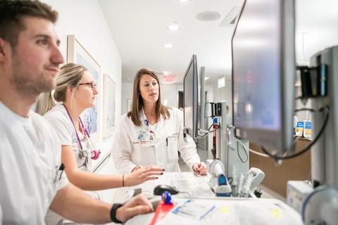 Nurses entering information onto computers