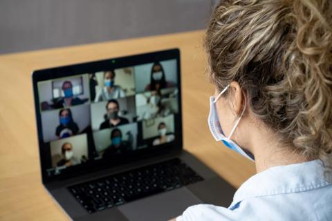 Woman in a video call with her coworkers during the COVID-19 pandemic