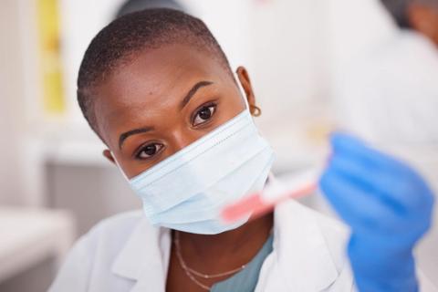 Nurse researcher with test tube