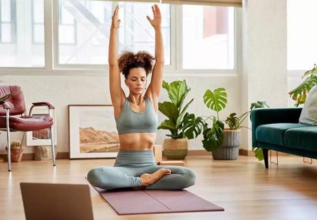 person doing yoga in living room