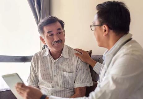 person speaking with primary care physician