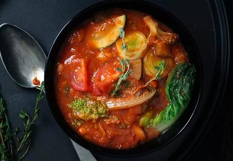 Bowl of tomato and vegetable soup.