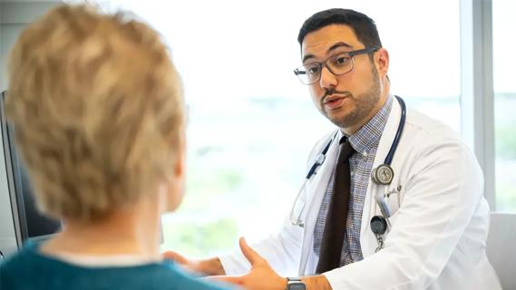Dr. Mustafa Ali and patient
