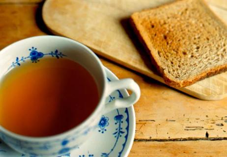 Teacup of tea and plate of toast