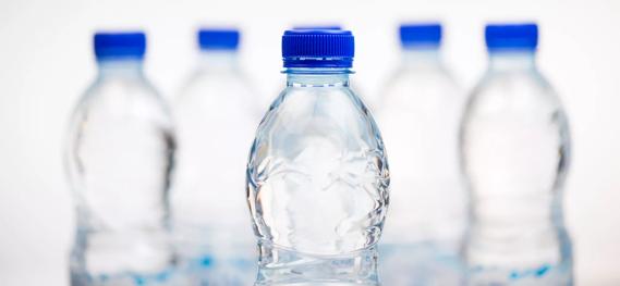 Bottles of water with blue caps