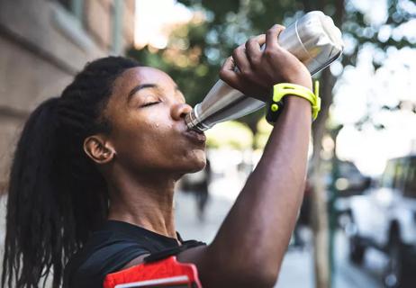 runner drinking after workout