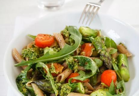 Penne pasta with arugula and asparagus.