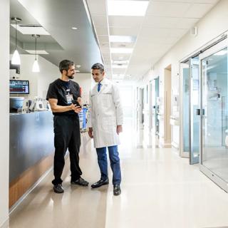 Doctor and nurse having a discussion in a hospital hallway