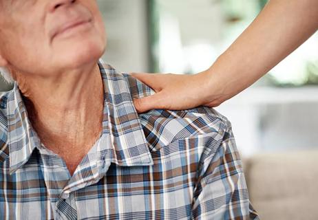 Older man being cared for