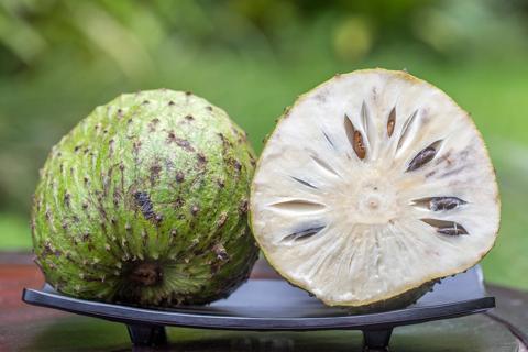 A soursop, guanabana, cut in half