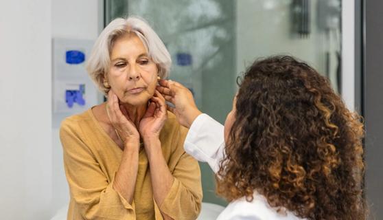 Healthcare provider examining patient's jaw