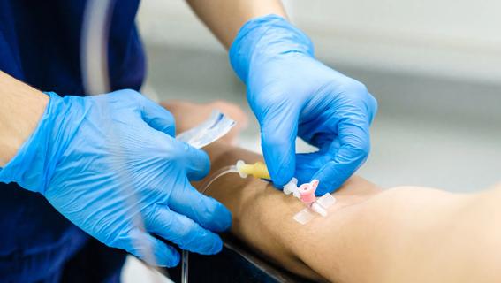 Nurse administers IV