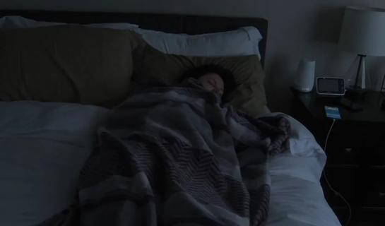 Person sleeping in bed