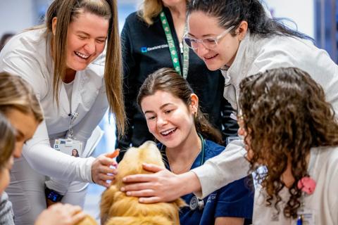 Group of nurses with therapy dog