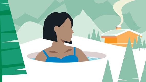 Person sitting in cold water tub outside in snowy landscape