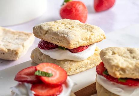 Strawberries and cream between homemade biscuits