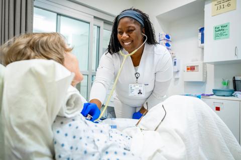 Student nurse with patient