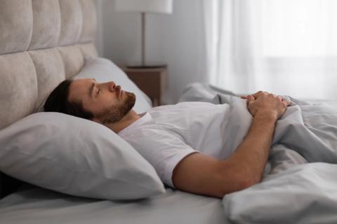 Person sleeping on back with head slightly elevated