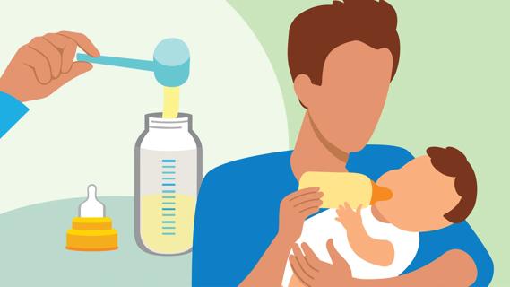 Caregiver feeding a baby with a bottle of baby formula