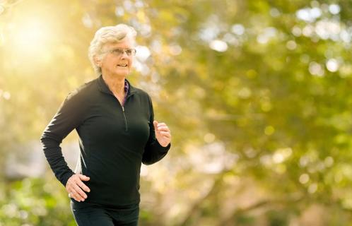 older woman jogging outside
