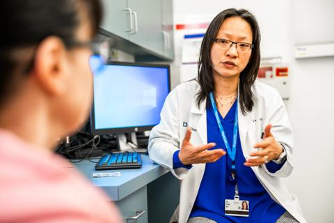 physician talking with a patient in medical office
