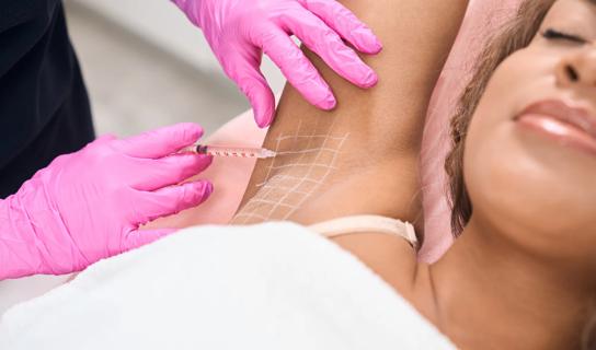 Person receiving Botox injections in their armpit
