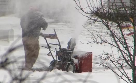 Man using snowblower