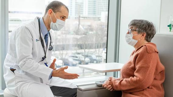 Doctor talking with patient