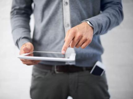 Man pointing to test results on a tablet