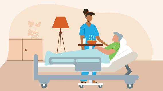Healthcare provider attending to a patient in a hospital bed