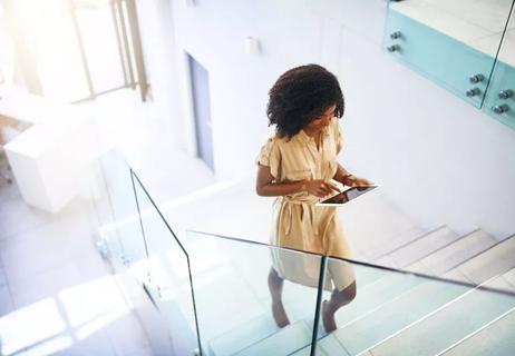 woman at work walkingup stairs