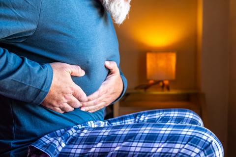 Patient holding stomach