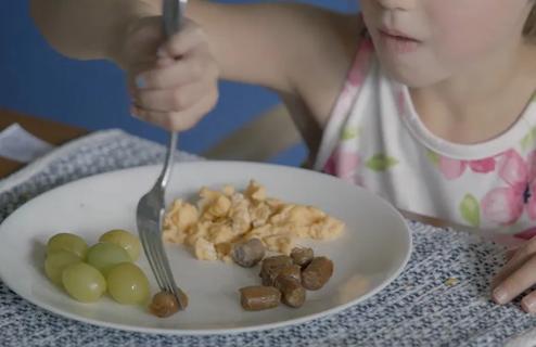 Child eating breakfast