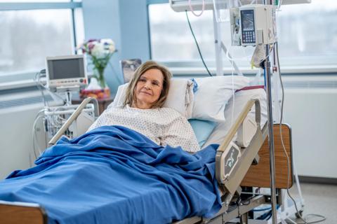 Patient reclining in hospital bed