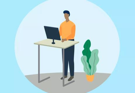 man working at a standing desk