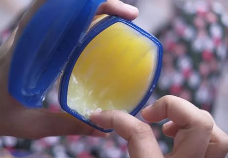 finger in a jar of petroleum jelly