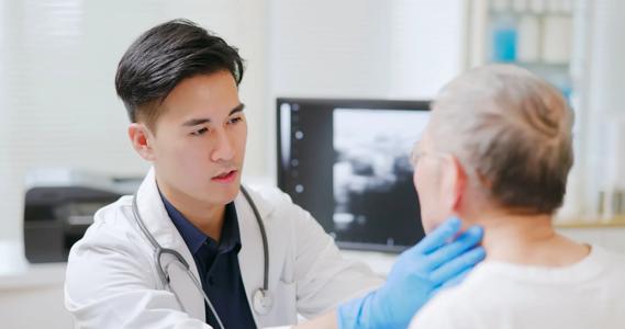 Doctor examining patient's lymph nodes