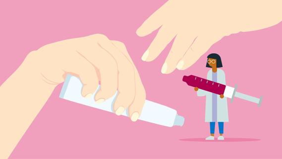 Female hands holding a tube of cream, with a healthcare provider holding an oversized syringe