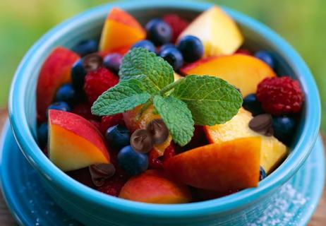 Peaches blueberries raspberries and chocolate