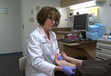 Doctor examining patient's feet.