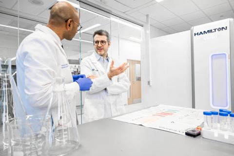 Dr. Liska speaking with researcher