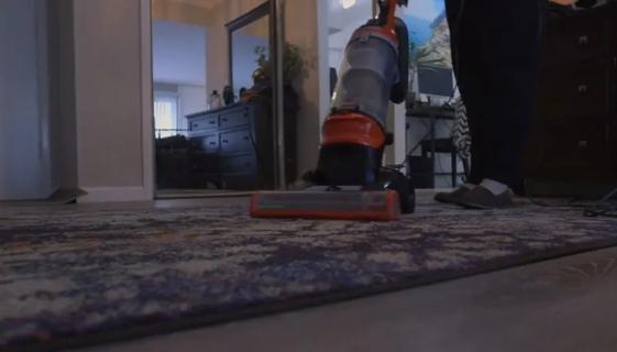 Person vacuuming