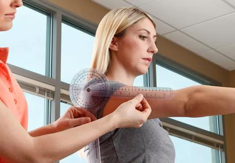 A caregiver measuring a woman's arm to assess her health and body measurements.