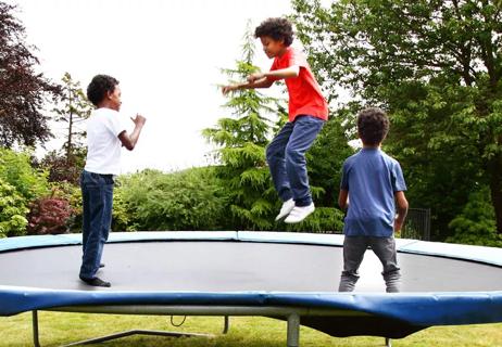 3 boys on a trampoline