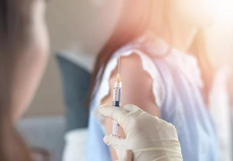 Woman recieving the measles vaccine