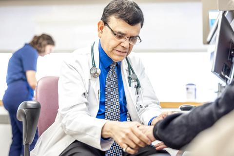Dr. Chatterjee with patient