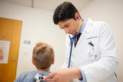 Dr. Amdani examines a young patient