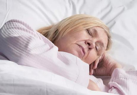 Older woman sleeping and snoring occasionally
